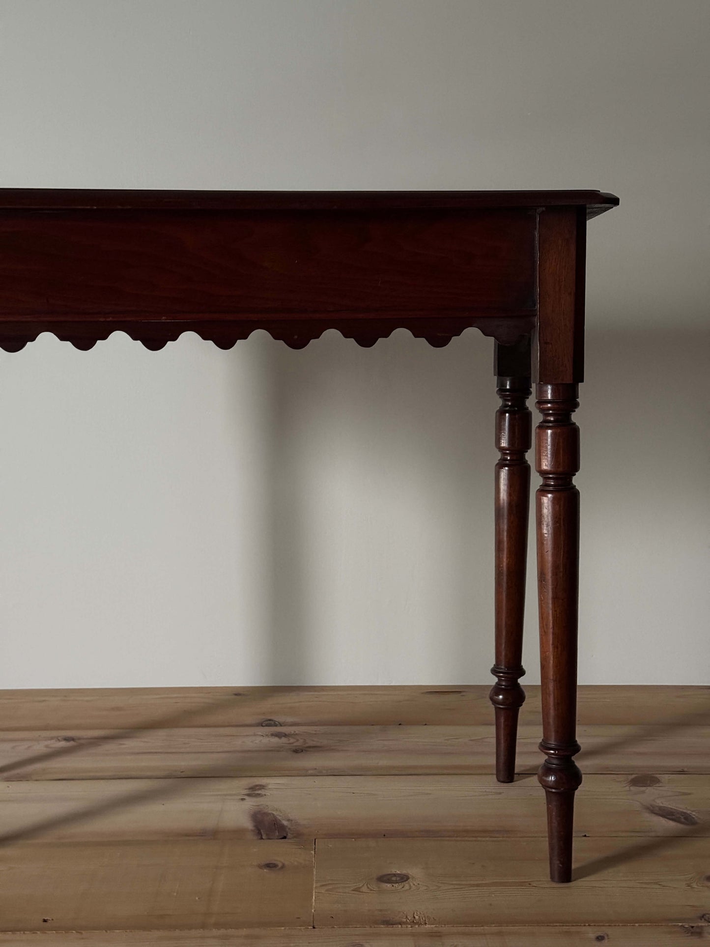 Antique walnut scalloped console table with drawer