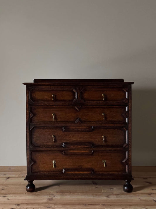 Antique Jacobean revival oak chest of drawers on bun feet