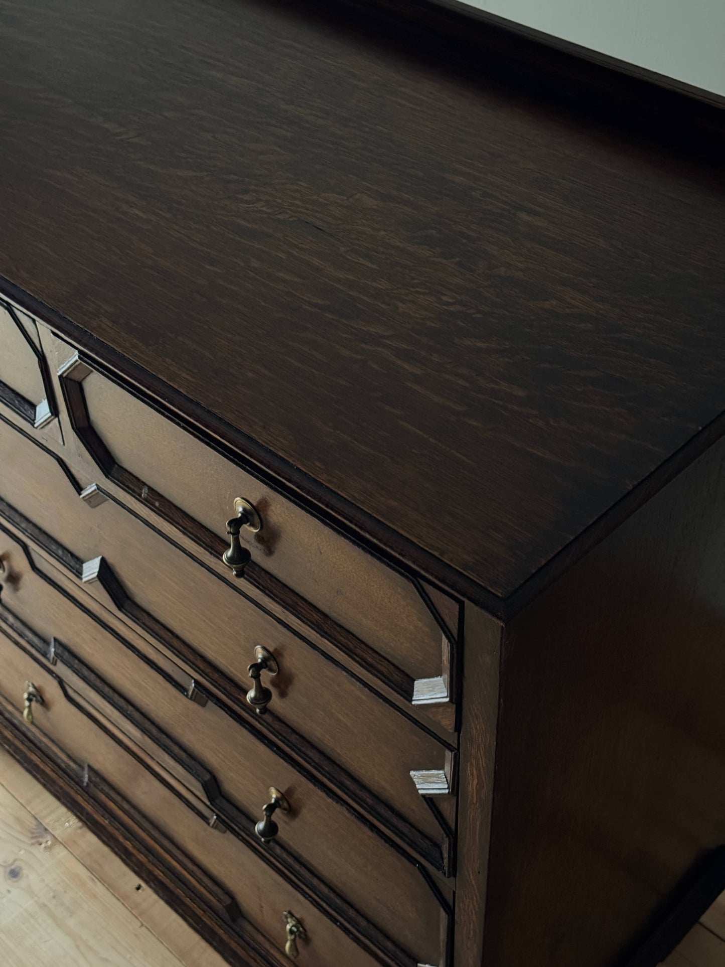 Antique Jacobean revival oak chest of drawers on bun feet