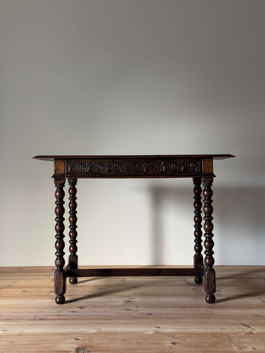 Antique oak console table with carved drawer
