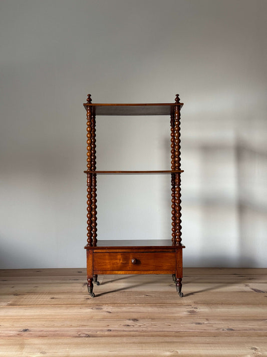 Early Victorian bobbin whatnot on castors