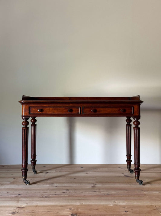 Victorian mahogany desk raised on fluted legs