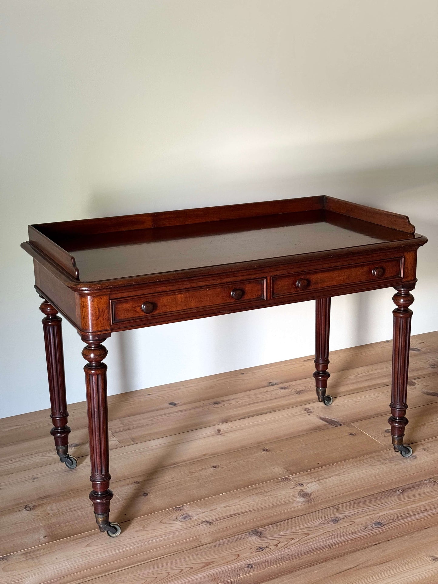 Victorian mahogany desk raised on fluted legs