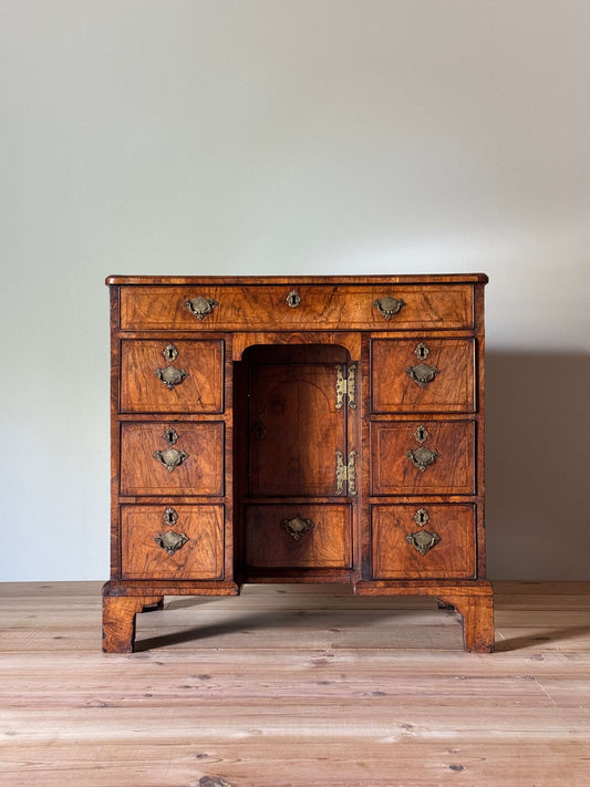 George II walnut cross-banded kneehole desk