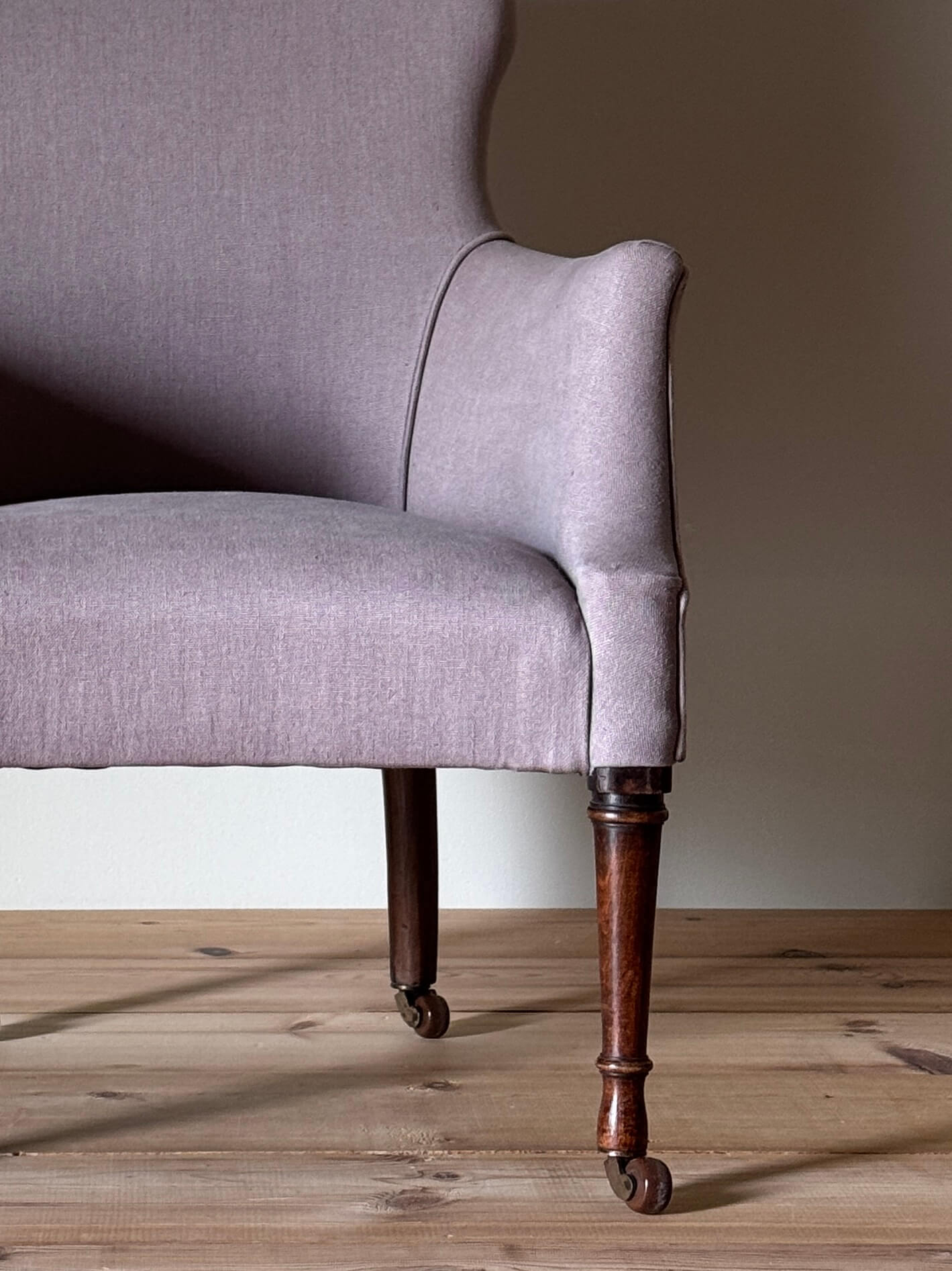 Victorian armchair raised on castors
