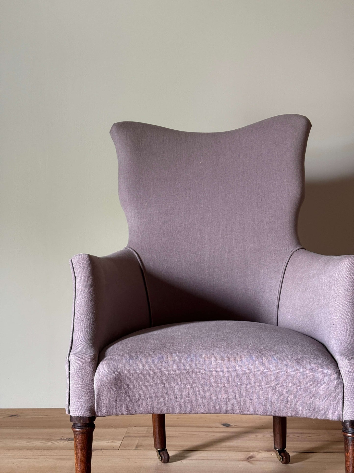 Victorian armchair raised on castors