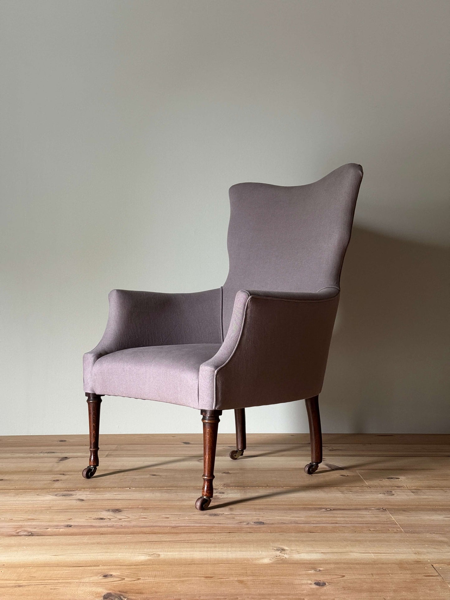 Victorian armchair raised on castors