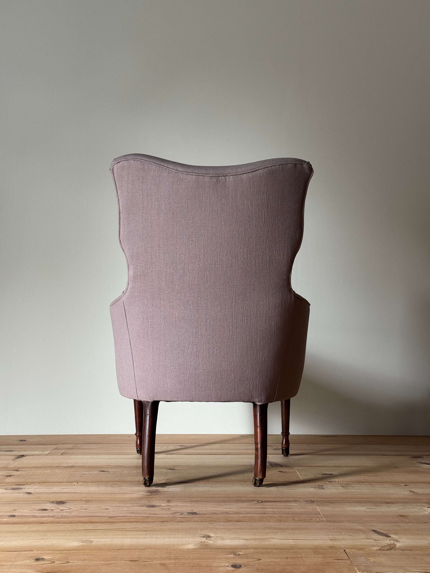 Victorian armchair raised on castors