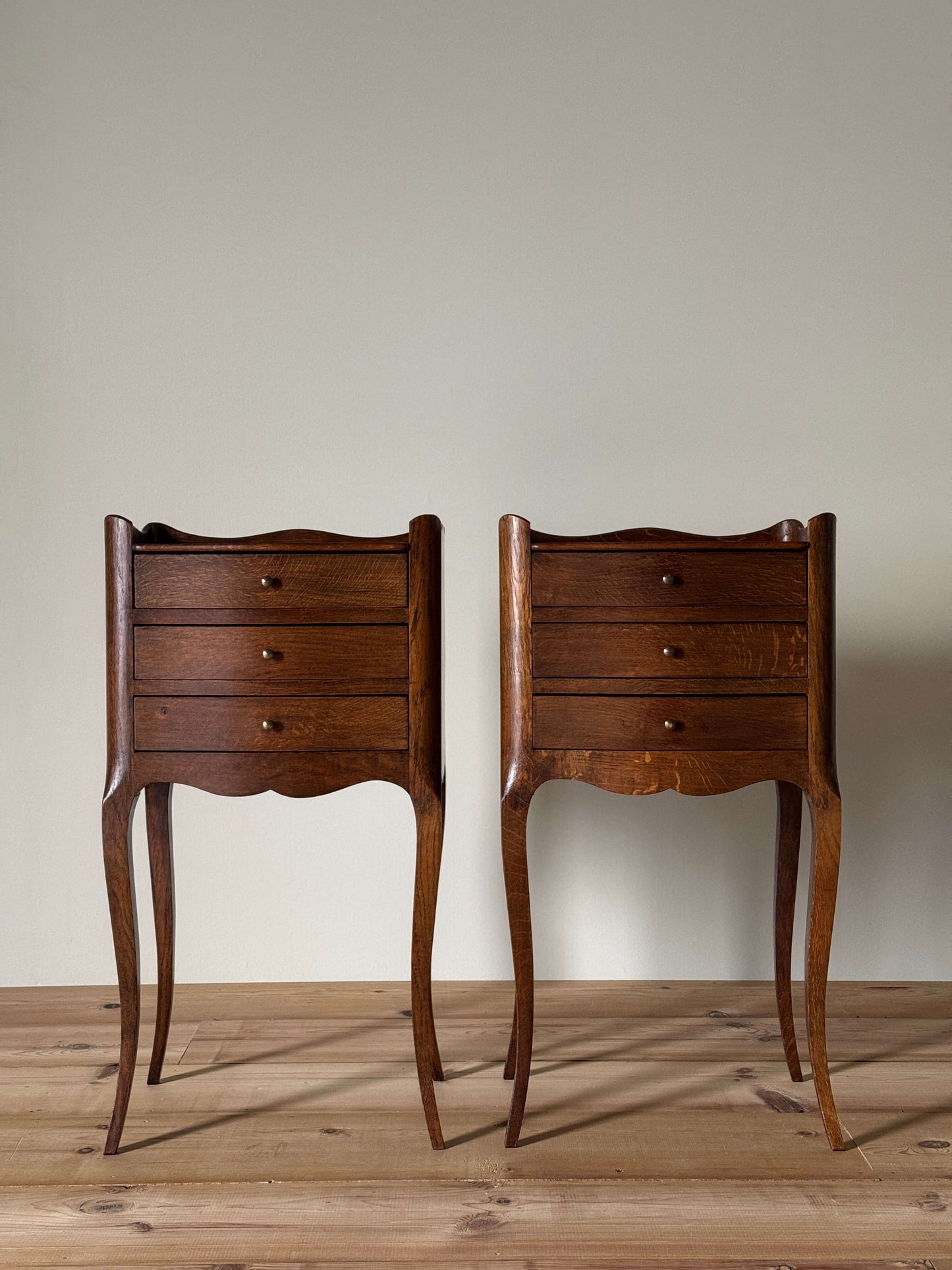 Pair of vintage French bedside tables with three drawers