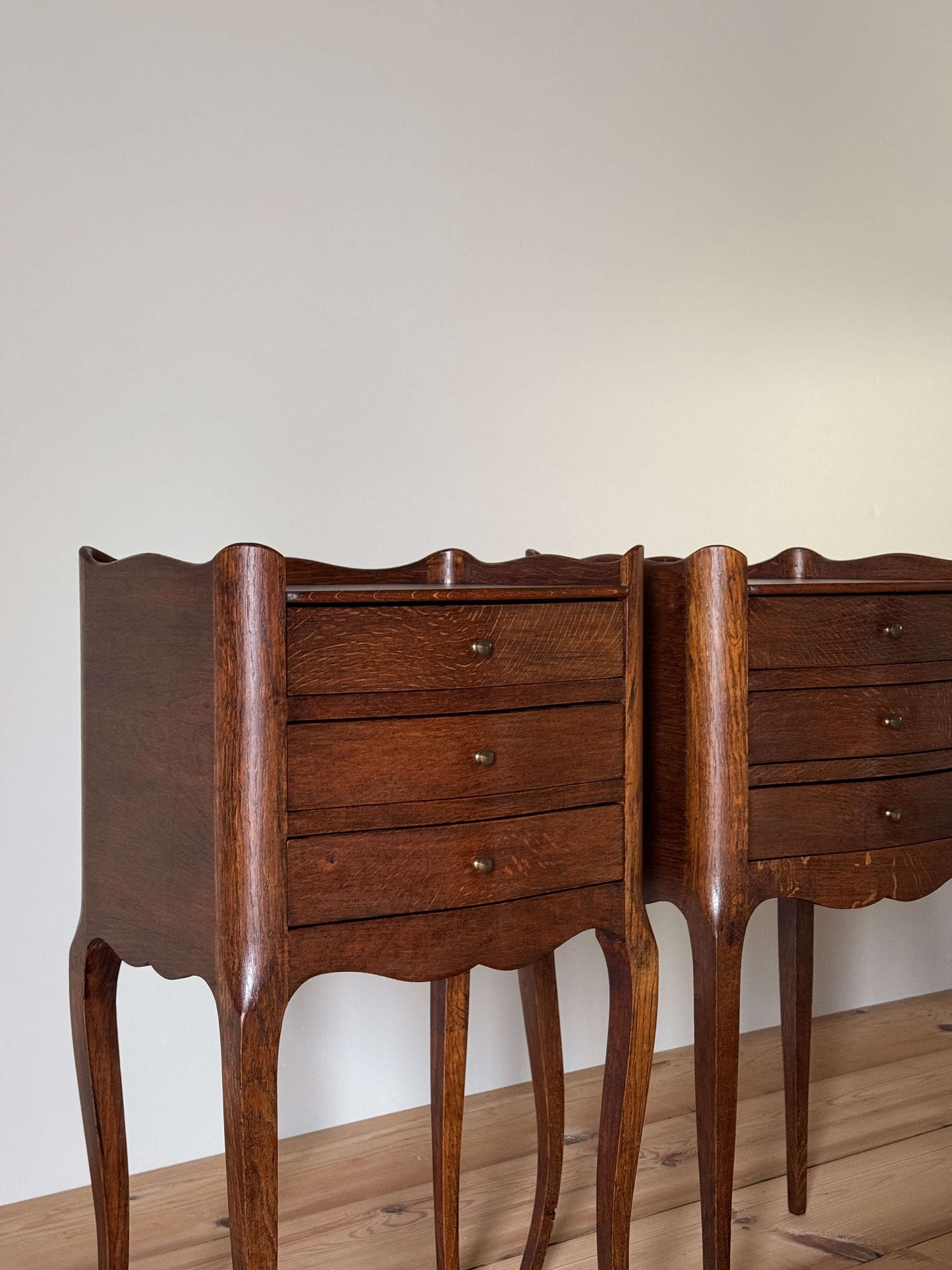 Pair of vintage French bedside tables with three drawers