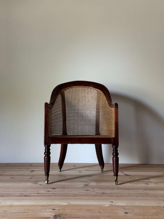 Antique beech bergere chair on castors
