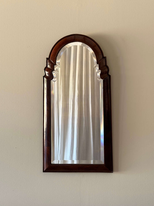 Antique walnut arched bevelled mirror
