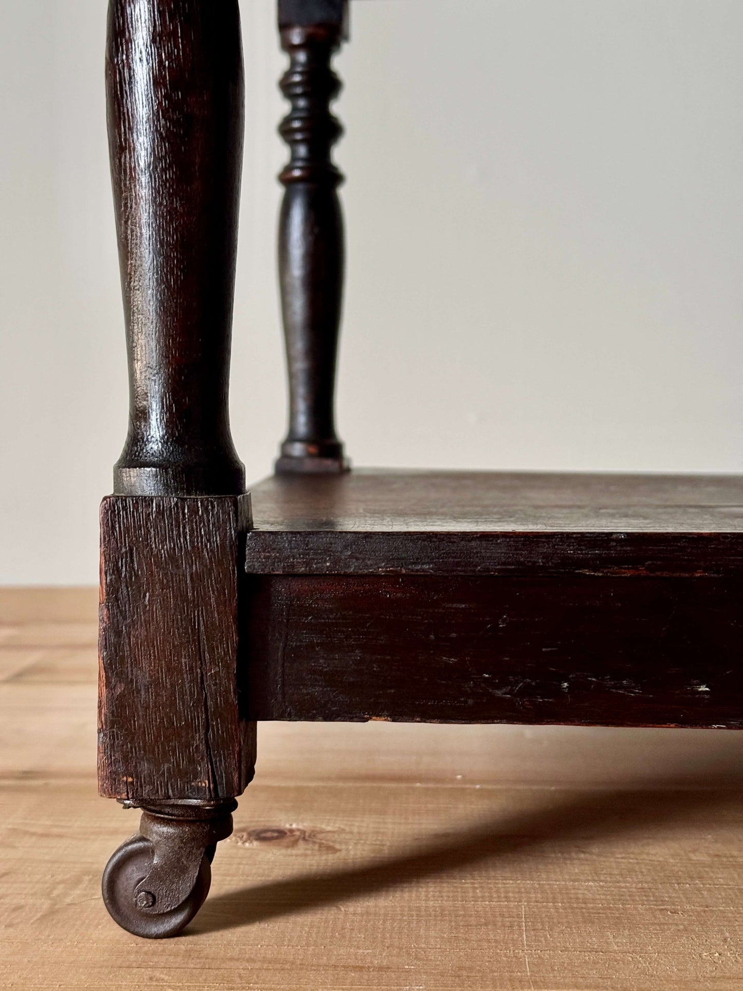 Edwardian three-tiered table on casters