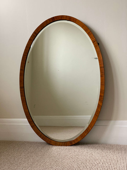 Antique oval walnut veneered mirror