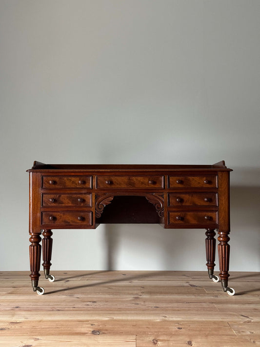 Victorian mahogany desk on castors by T.H.Filmer