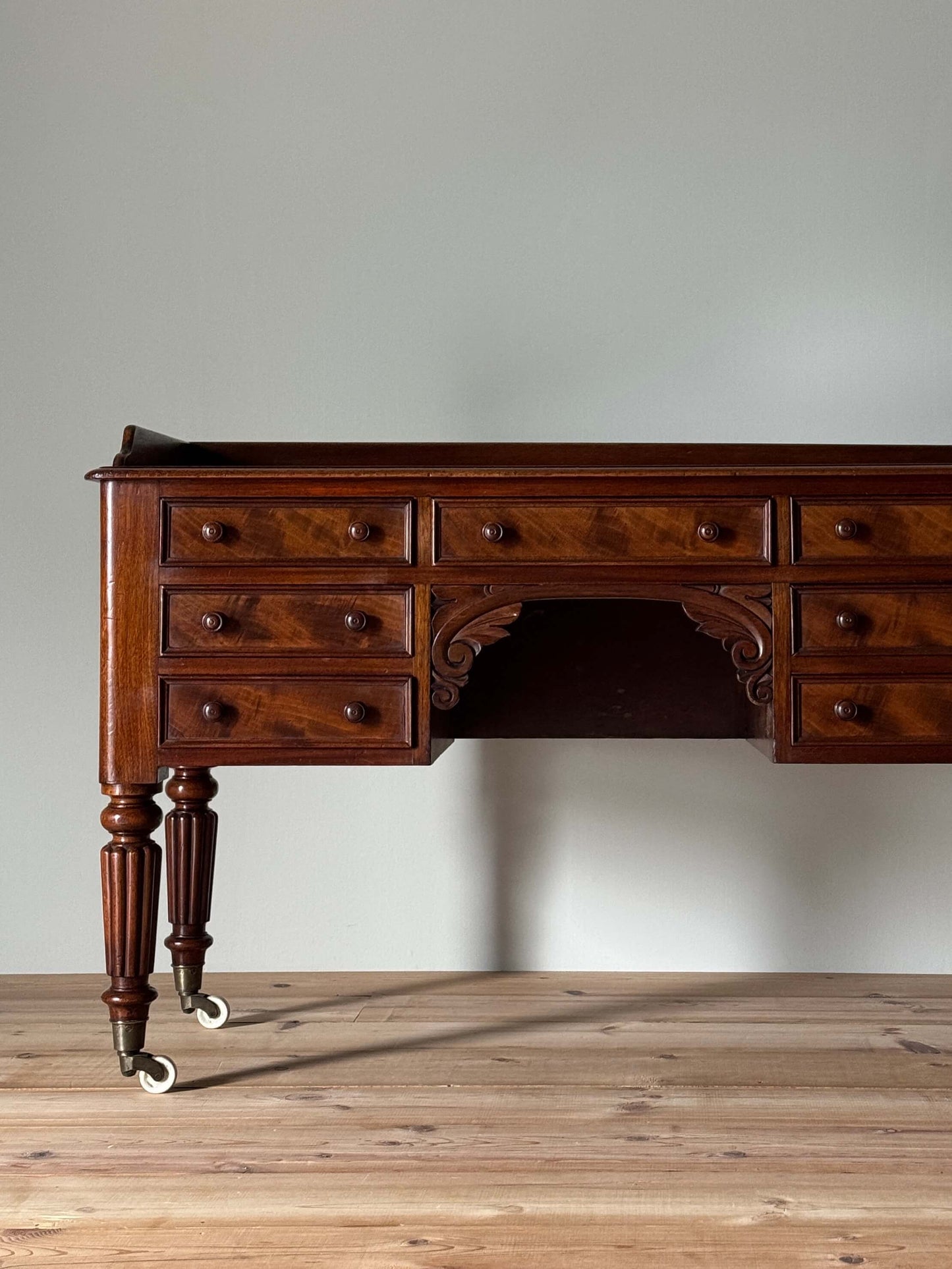 Victorian mahogany desk on castors by T.H.Filmer