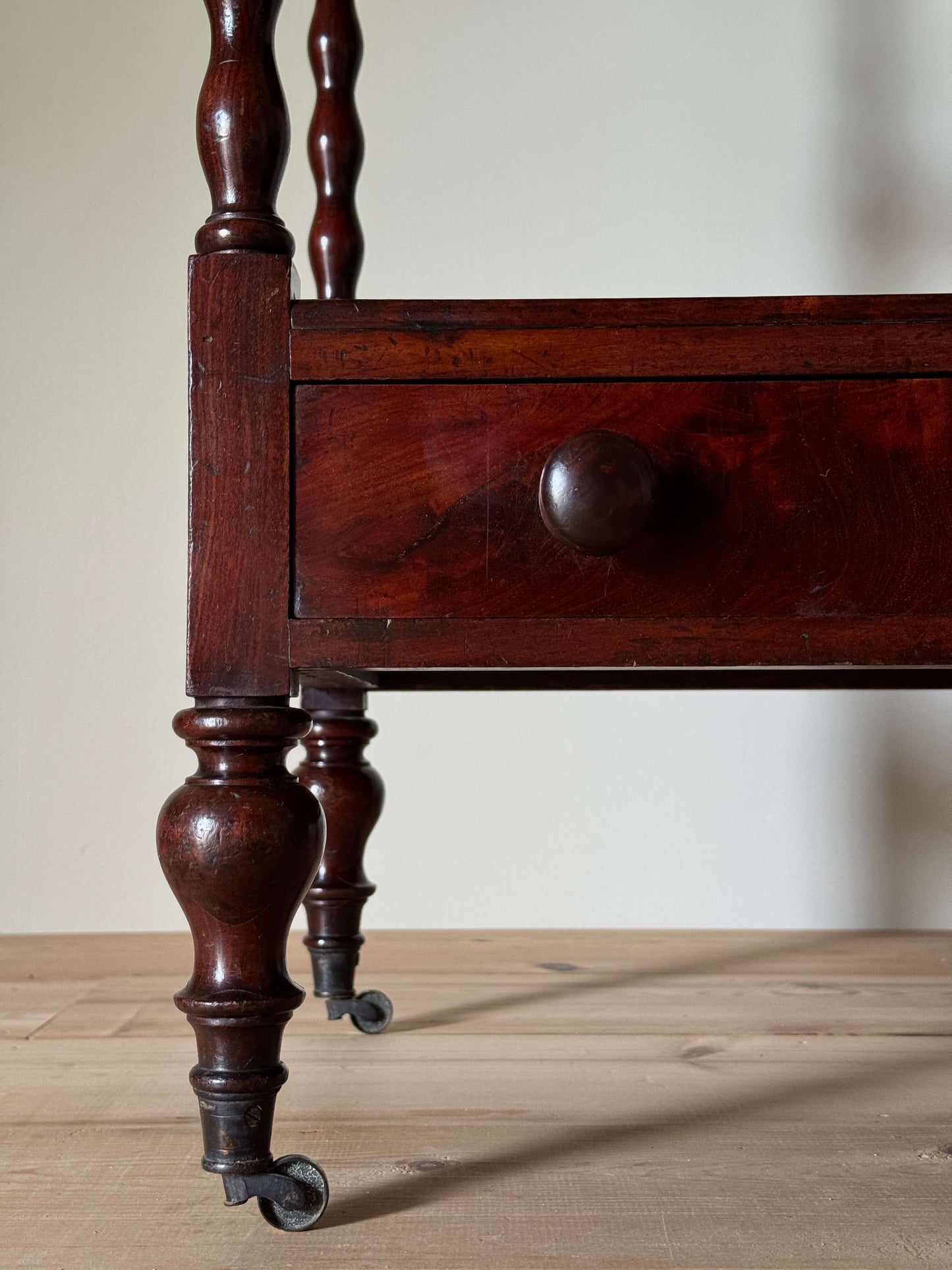 Victorian mahogany bobbin whatnot on castors