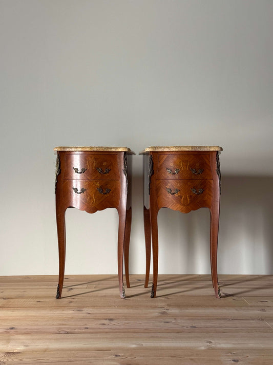 Pair of French 20th-century bedside tables with marble tops