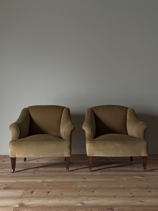 ON HOLD Pair of Edwardian armchairs on casters