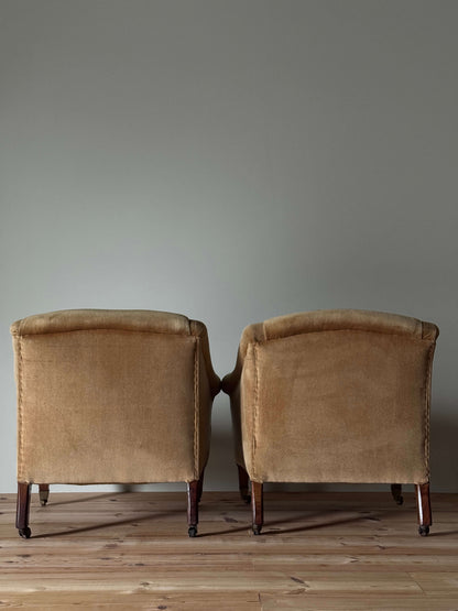 ON HOLD Pair of Edwardian armchairs on casters