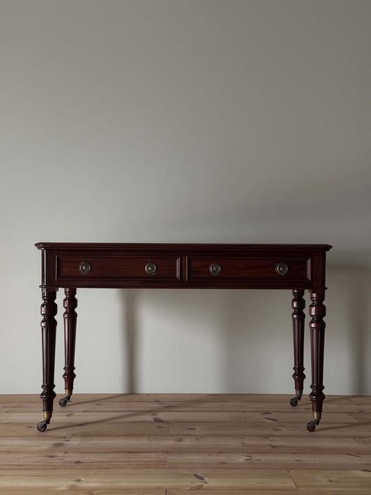 Antique desk on brass casters by James Shoolbred & Co