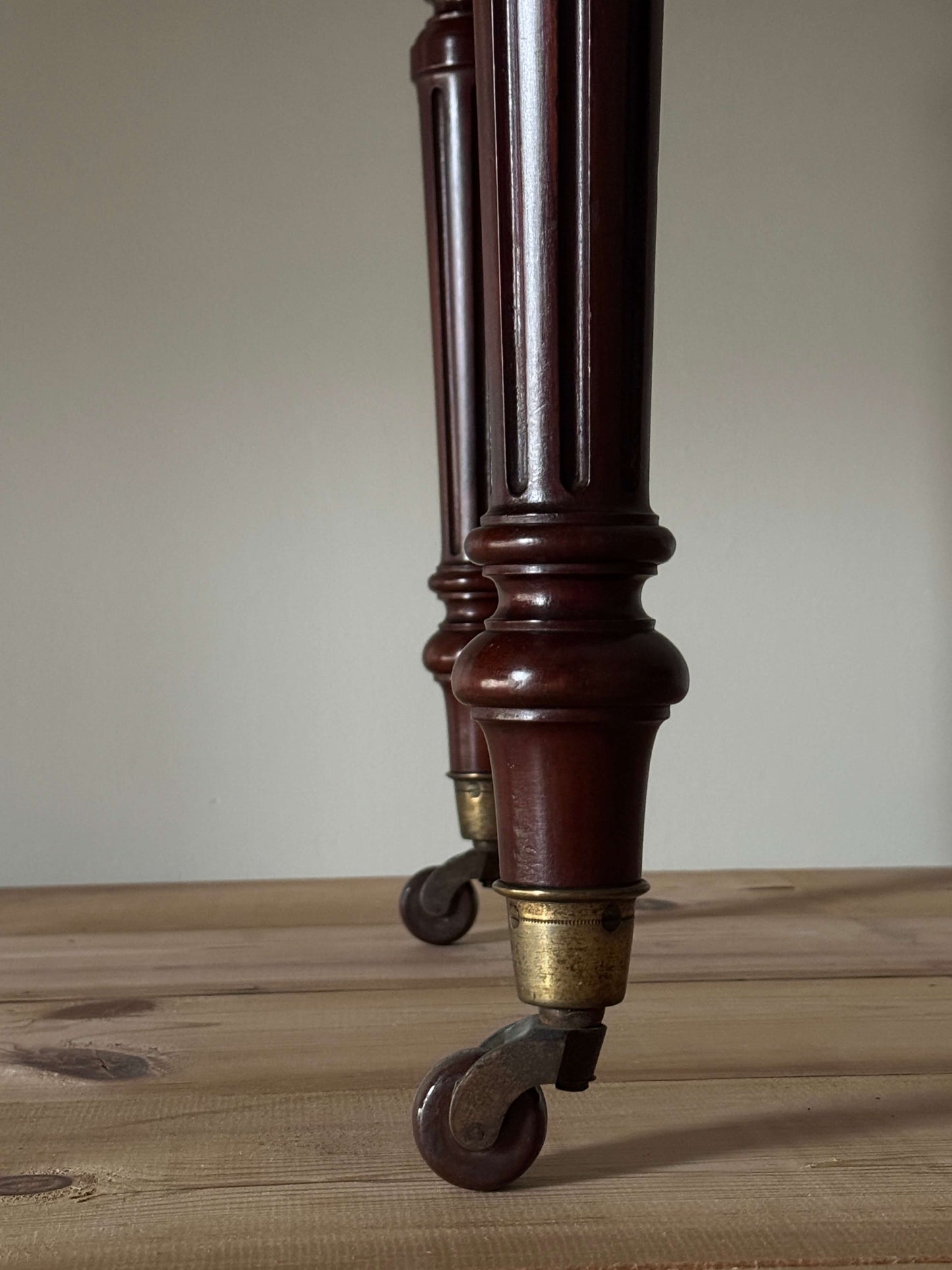 Antique desk on brass casters by James Shoolbred & Co