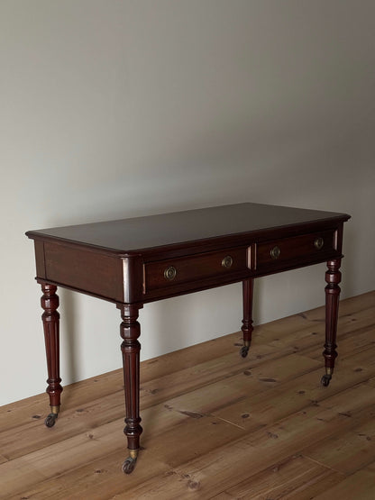 Antique desk on brass casters by James Shoolbred & Co