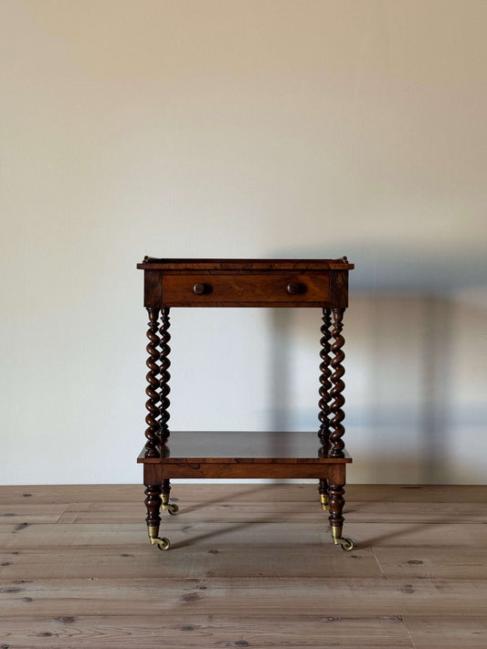 Early Victorian rosewood whatnot on castors