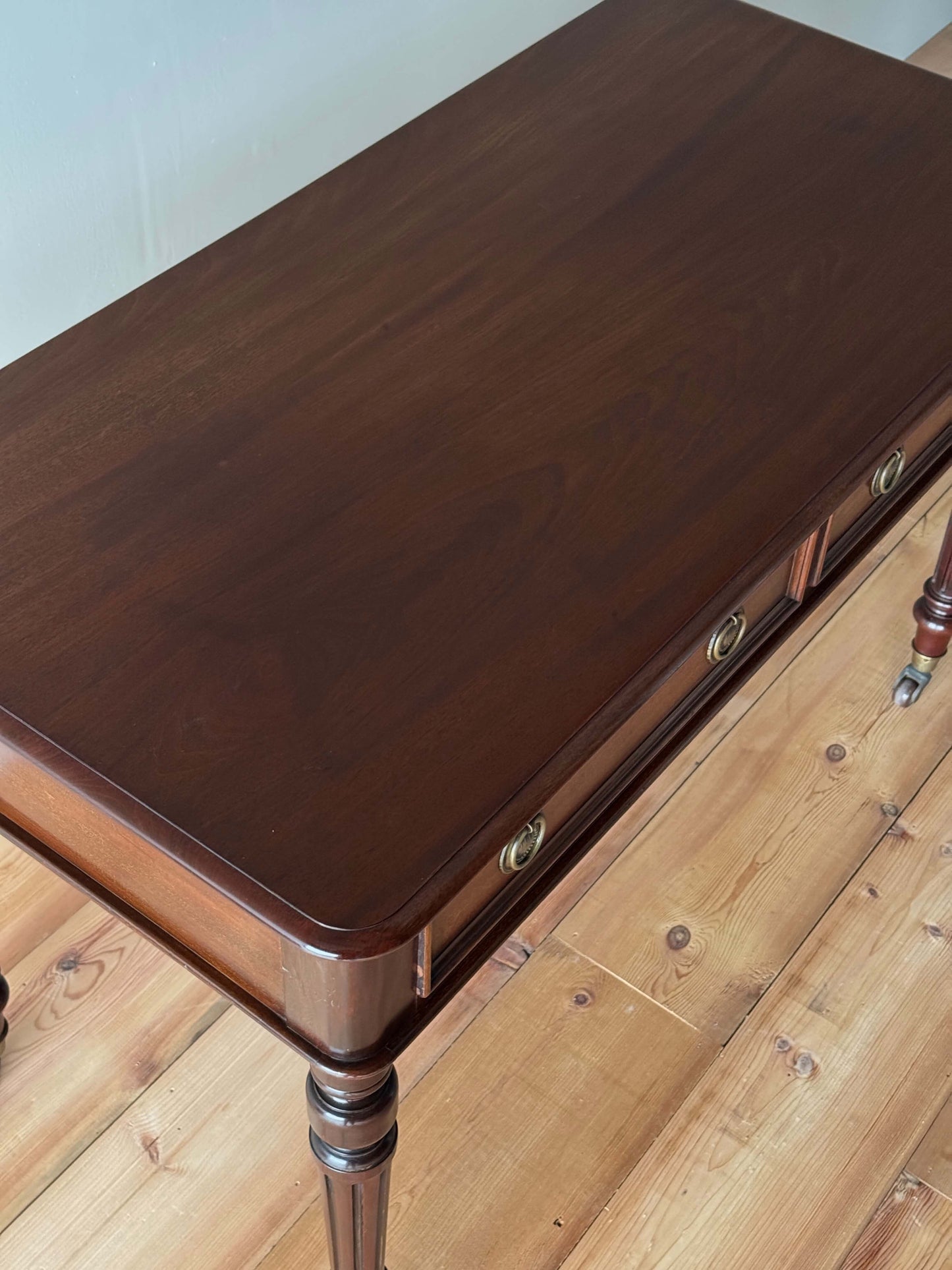 Antique desk on brass casters by James Shoolbred & Co