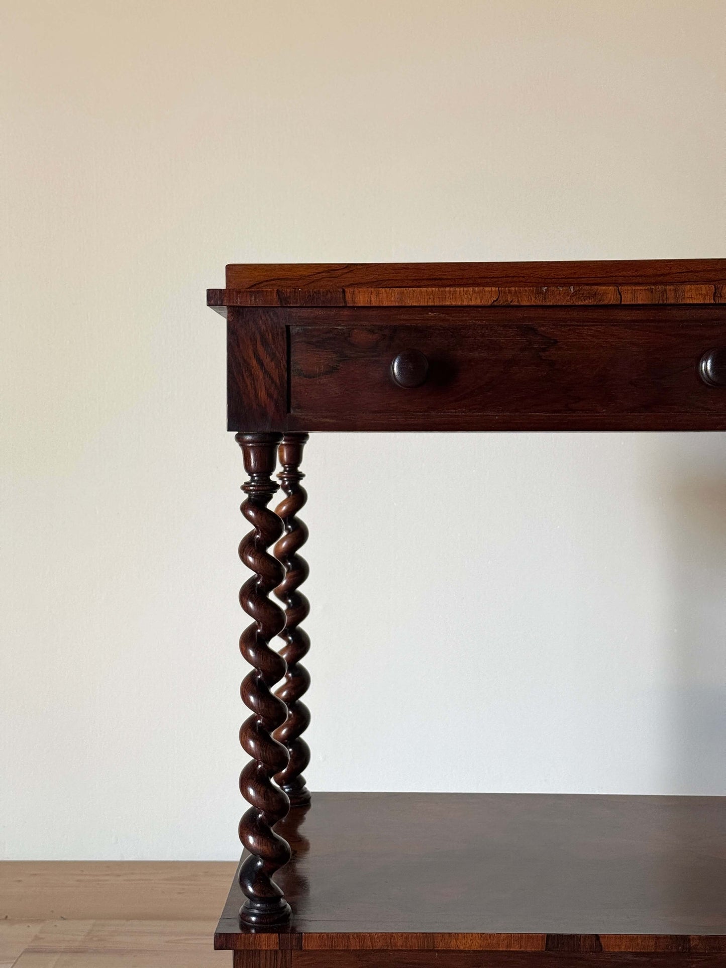Early Victorian rosewood whatnot on castors