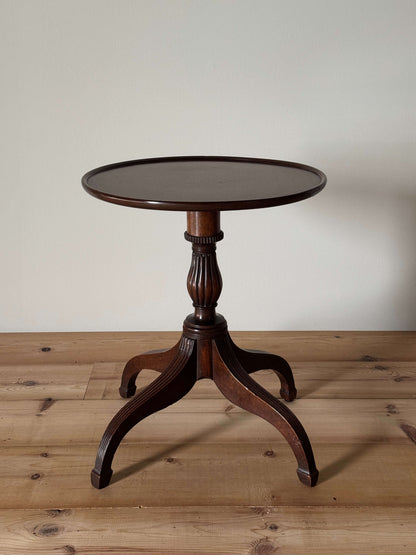 Early Victorian mahogany occasional table on reeded legs