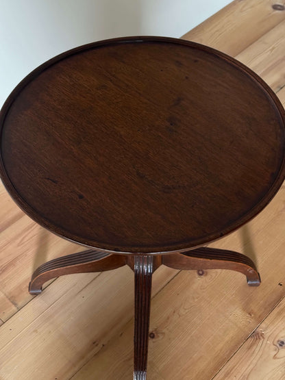 Early Victorian mahogany occasional table on reeded legs