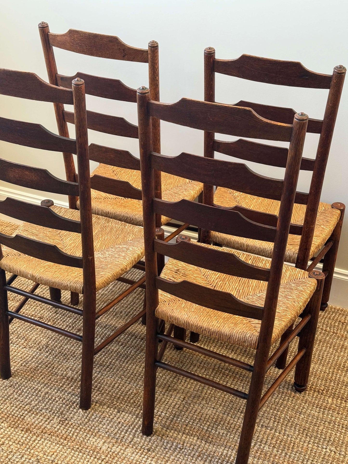 Set of four late 19th-century ladderback rush dining chairs