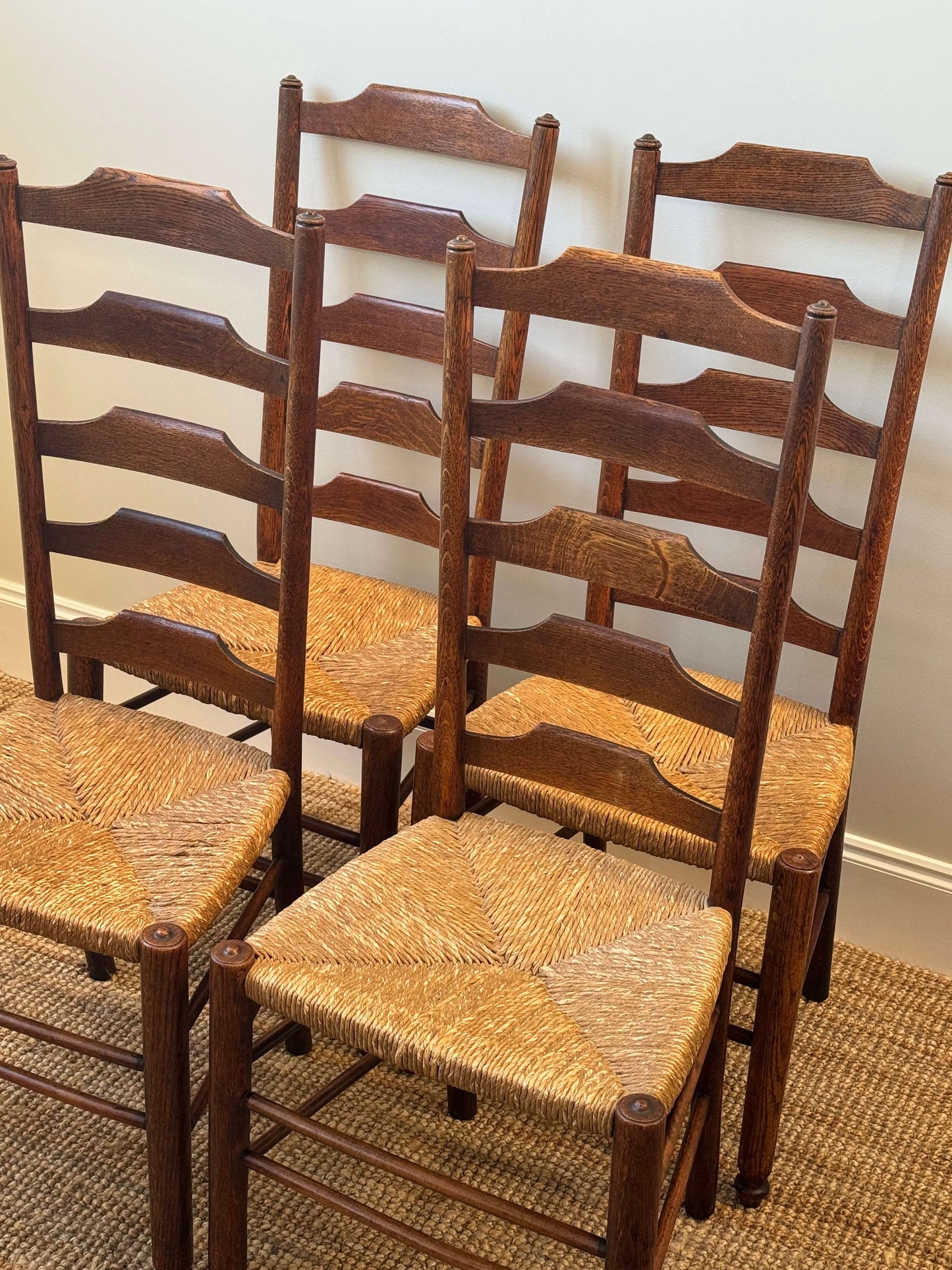 Set of four late 19th-century ladderback rush dining chairs