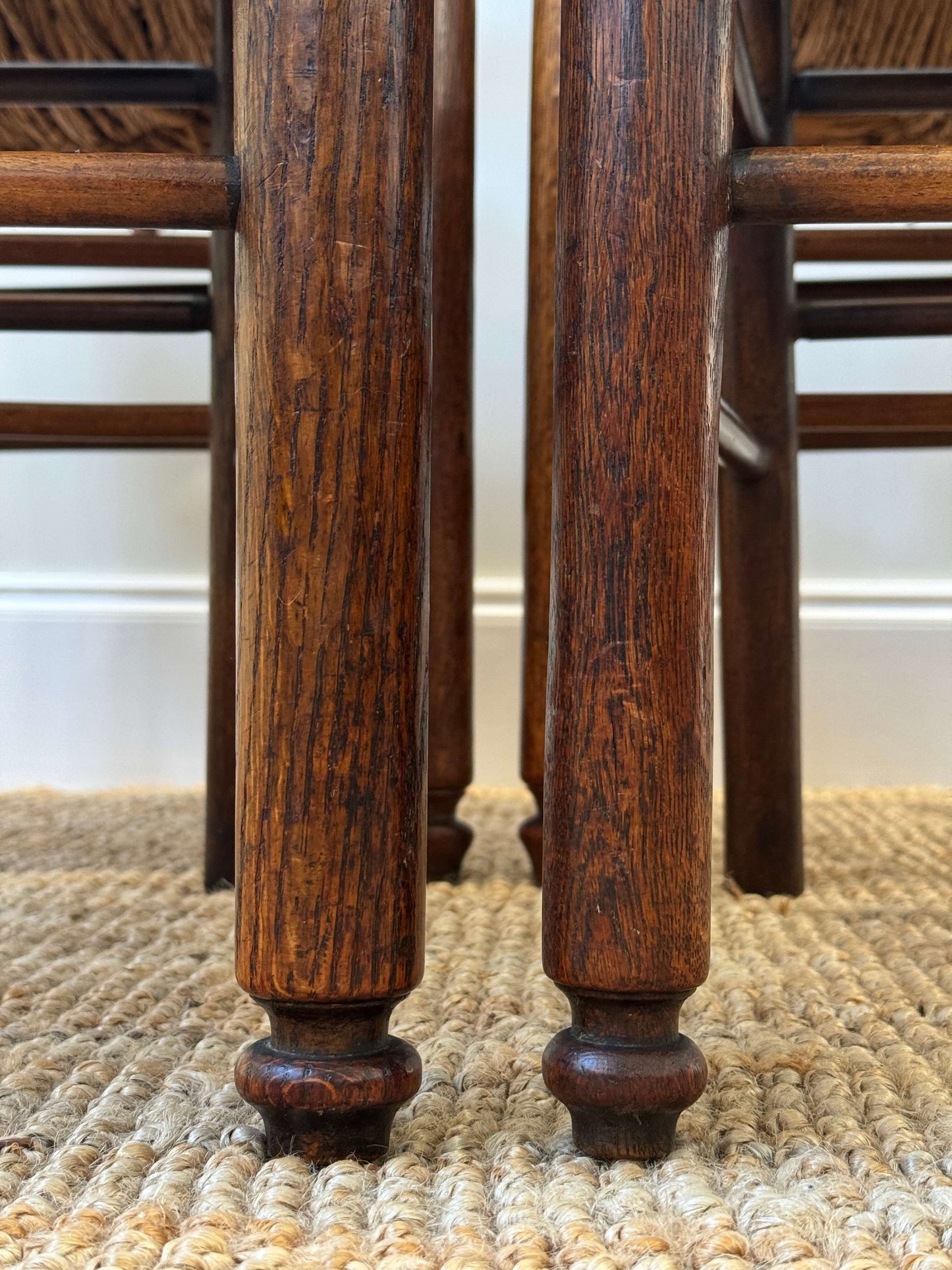 Set of four late 19th-century ladderback rush dining chairs