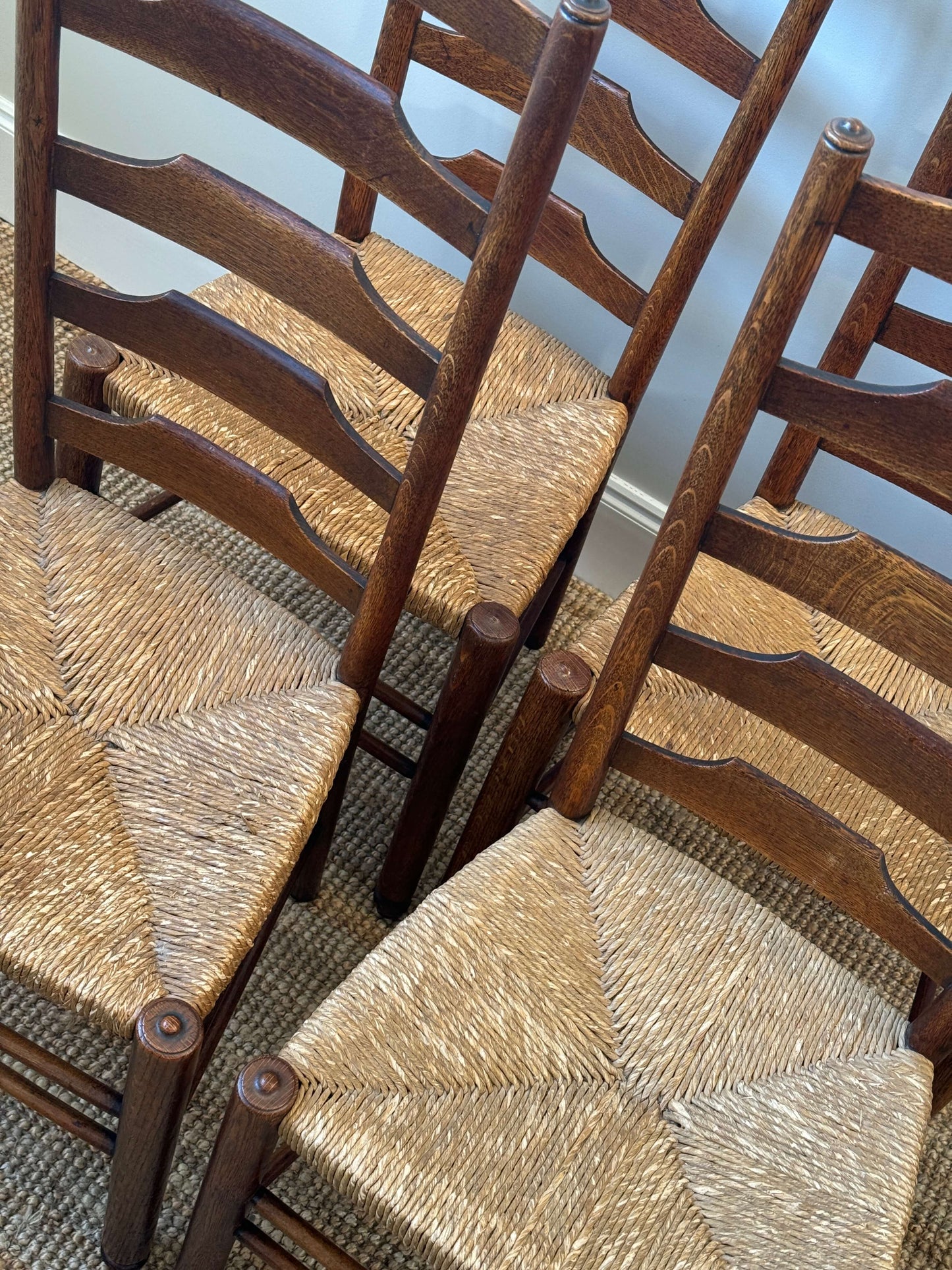 Set of four late 19th-century ladderback rush dining chairs