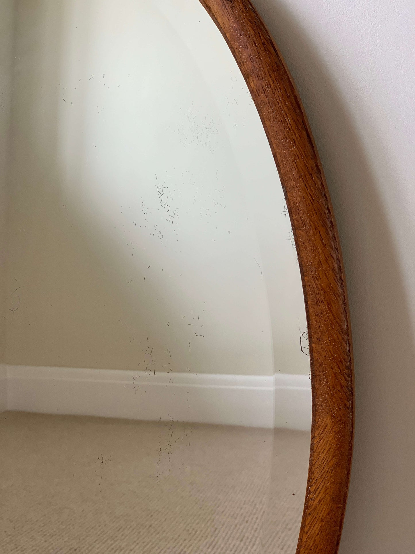 Antique light oak oval mirror