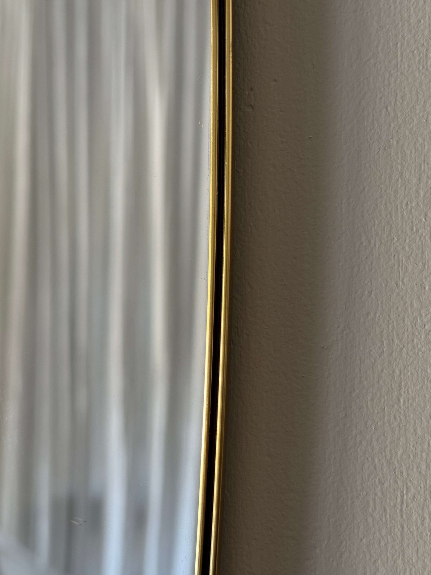 Mid-century brass pill mirror