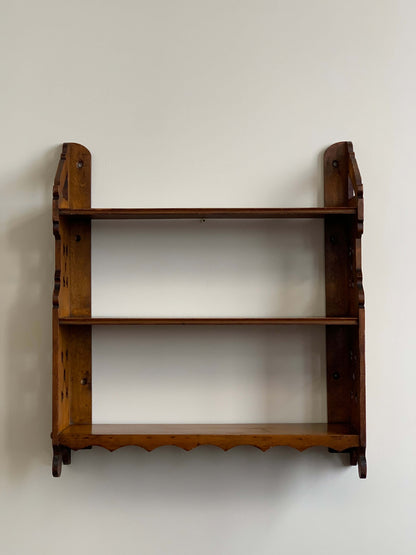 Antique shelf with scalloped detail