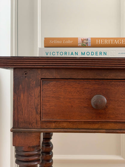 Antique bobbin console table on brass casters