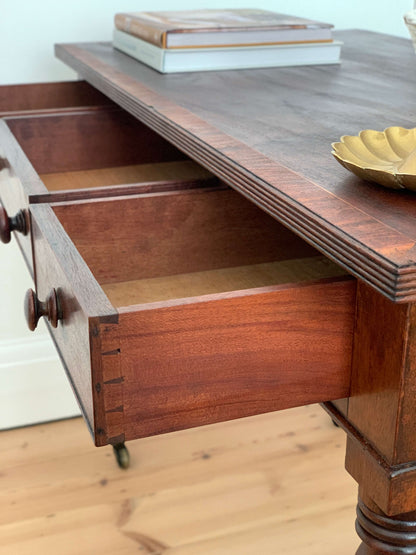 Antique bobbin console table on brass casters