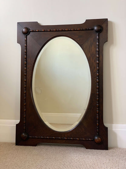 Antique oak oval framed mirror