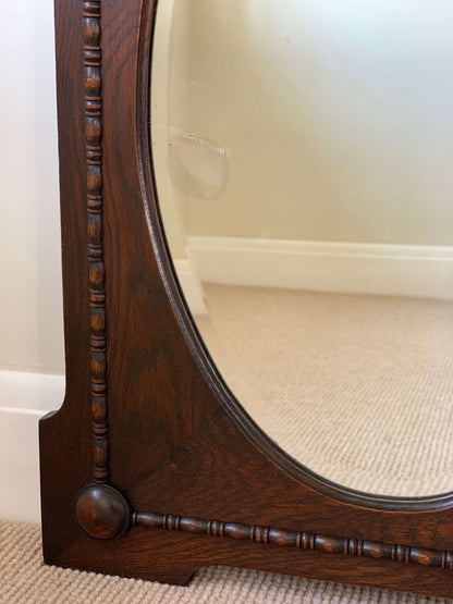 Antique oak oval framed mirror