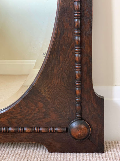 Antique oak oval framed mirror