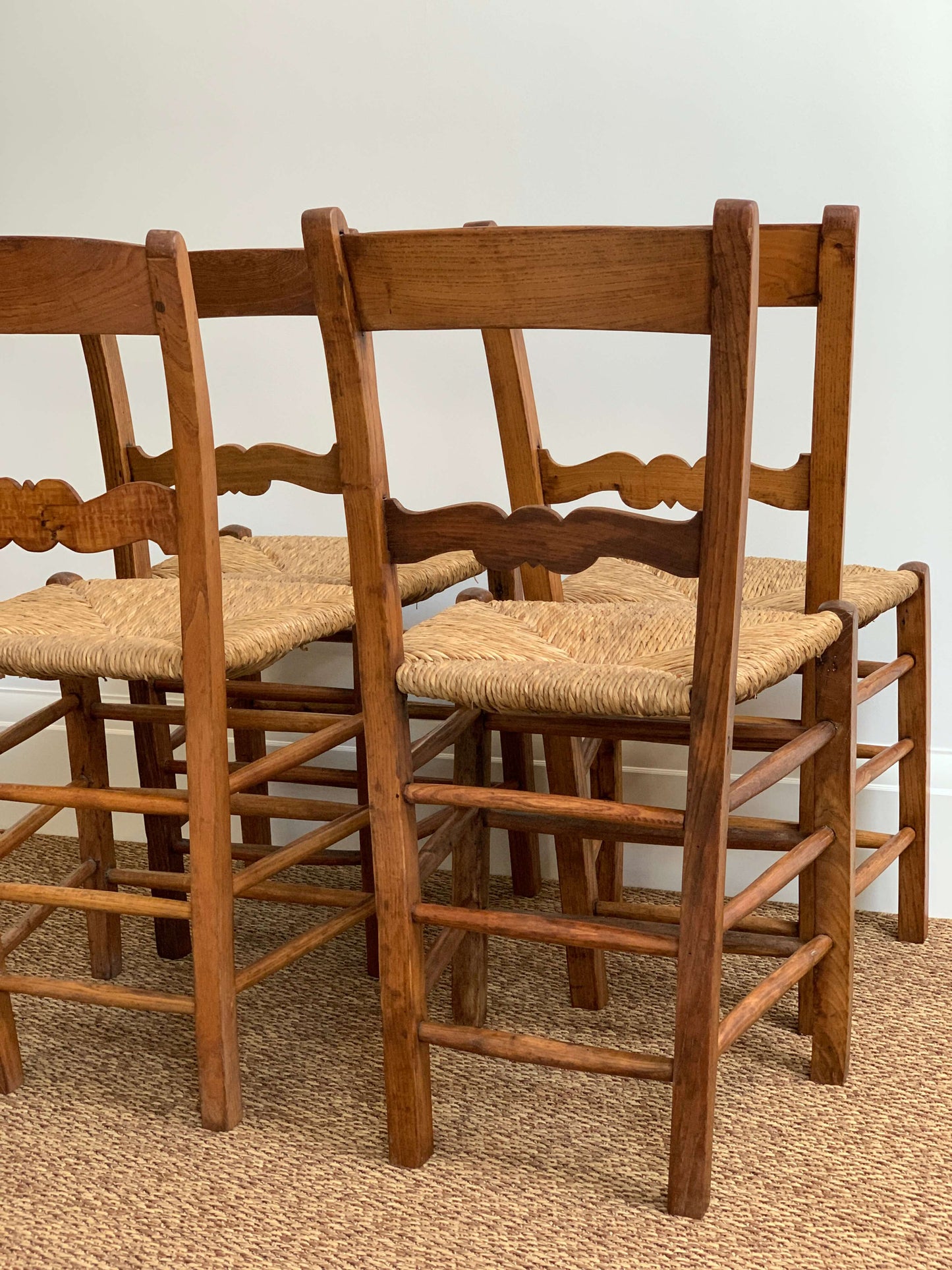 Set of four antique rush dining chairs