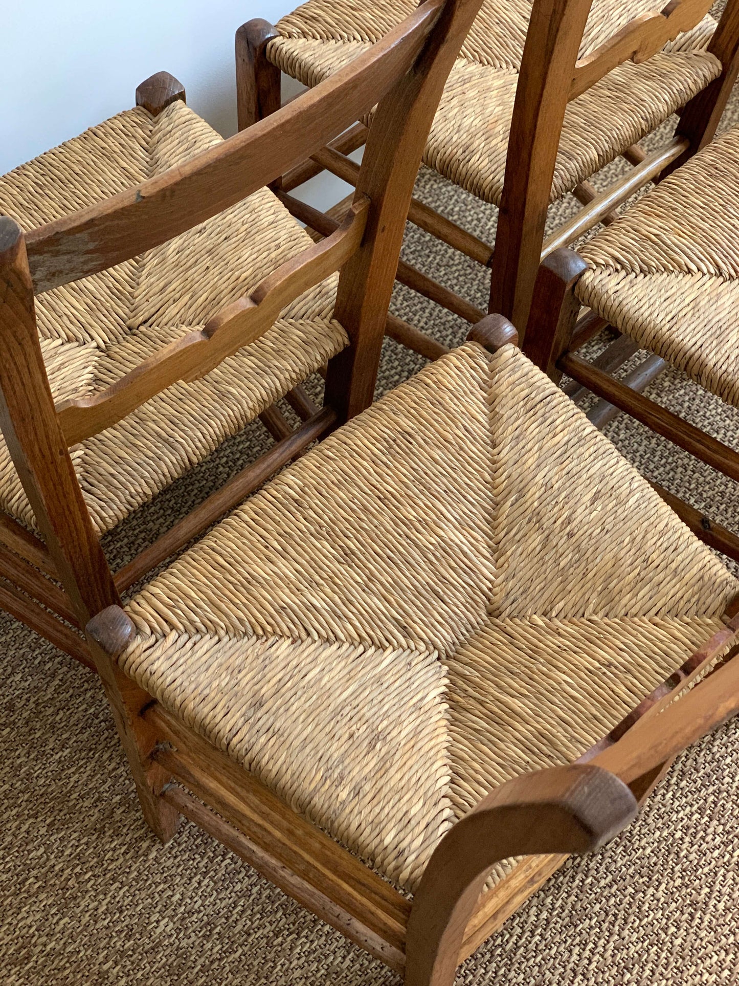 Set of four antique rush dining chairs