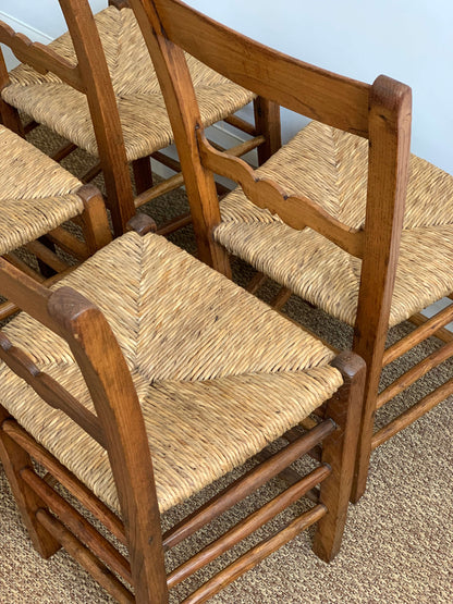 Set of four antique rush dining chairs