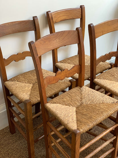 Set of four antique rush dining chairs