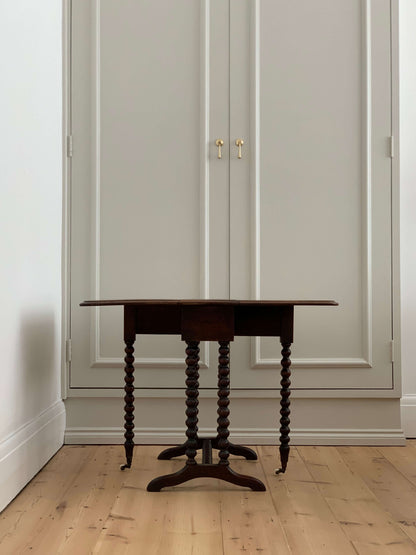 Antique bobbin drop-leaf table with casters