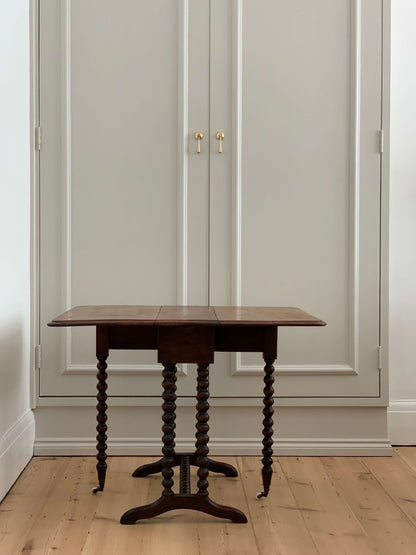 Antique bobbin drop-leaf table with casters